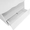 A close-up view of a white table with an open drawer and a shelf above it. Voir les images du produit