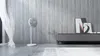 A modern living room with a standing fan and a TV console. Anteprima dell’immagine prodotto