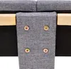 A close-up view of the connection points of a bed frame, showing metal screws and wooden supports. Voir les images du produit