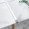A close-up view of a transparent polycarbonate sheet with a ribbed texture, supported by a wooden leg and metal brackets. The sheet is part of a larger structure, possibly a greenhouse or canopy. Voir les images du produit