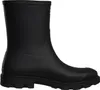 A black short Wellington boot shown from the side. Produktbild-Vorschau