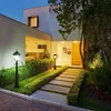 A modern house entrance at dusk, illuminated by outdoor lighting. Produktbild-Vorschau
