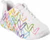 A white sneaker with colorful heart designs. Voir les images du produit