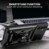 A black smartphone case with a ring stand is shown in a close-up shot, with a laptop and headphones in the background. Produktbild-Vorschau