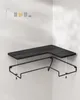 A black corner shelf assembly kit is shown on a white wall. Náhled obrázku produktu