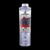 A portable blender filled with fruit and ice, against a black background. Náhled obrázku produktu