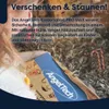 A child is holding a tablet wrapped in festive paper, with candy canes in the background. Produktbild-Vorschau