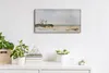 A rectangular wall clock with a watercolor beach landscape hangs on a white wall above a white shelf with decorative plants and books. Produktbild-Vorschau