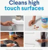 Collage of four images showing Clorox wipes being used to clean various high-touch surfaces, with text overlay. Náhľad obrázku produktu