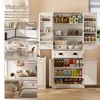 A multi-panel collage showing a tall white cabinet filled with various items, alongside smaller images demonstrating its use in different rooms like a kitchen, dining room, living room, and bedroom. Podgląd zdjęcia produktu