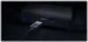 A close-up shot of a USB 3.0 port on a black electronic device, with a USB cable plugged in. Podgląd zdjęcia produktu