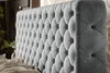A close-up view of a tufted headboard of a bed. Náhľad obrázku produktu