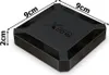 A black multimedia smart TV box with dimensions indicated. Náhľad obrázku produktu
