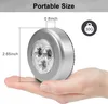 A hand holding a small, silver LED light, with dimensions and weight indicated. Produktbild-Vorschau