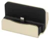A close-up studio shot of a gold and black docking station with a lightning connector. Anteprima dell’immagine prodotto