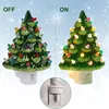 Two ceramic Christmas trees, one lit and one unlit, with a close-up of the plug and switch. Náhľad obrázku produktu