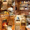 A collage of four images showcasing a miniature DIY book nook kit, depicting a detailed, atmospheric library scene with furniture, books, and decorative elements. Voir les images du produit