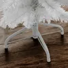 Close-up of the base and lower branches of a white artificial Christmas tree, standing on a wooden floor. Náhľad obrázku produktu