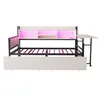 A white and black metal daybed with drawers, a built-in shelf unit with pink LED lighting, and an attached desk on wheels. Produktbild-Vorschau