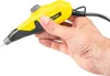 A hand holding a yellow and black engraving tool. Produktbild-Vorschau