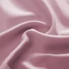 A close-up view of draped pink fabric, showcasing its texture and folds. Produktbild-Vorschau