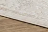 A close-up view of the edge of a rug on a wooden floor. Produktbild-Vorschau