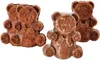 Three chocolate bear-shaped treats are arranged on a white background. Two are dark brown and appear to be cakes or brownies, while one in the foreground is milk chocolate and appears to be a solid chocolate mold. Anteprima dell’immagine prodotto