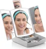 A woman is applying makeup using a tri-fold mirror with integrated LED lights and a makeup organizer. Podgląd zdjęcia produktu
