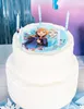 A two-tiered white cake decorated with Frozen characters and candles. Anteprima dell’immagine prodotto