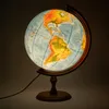 A lit globe on a wooden stand with a black power cord. Podgląd zdjęcia produktu