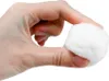 A hand is holding a white cotton ball. Produktbild-Vorschau