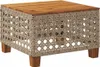 A square coffee table with a wooden top and a woven rattan-like base, supported by four wooden legs. Produktbild-Vorschau