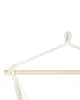 Close-up of a hammock chair's wooden bar and rope suspension. Produktbild-Vorschau