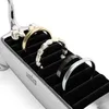 A close-up shot of a jewelry stand with several rings on it. Anteprima dell’immagine prodotto