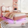 A child's bedroom with a pink bed, desk, and shelves. Produktbild-Vorschau