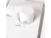 A close-up view of a white dial on a white appliance. Náhled obrázku produktu
