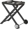 A black folding grill stand with wheels, shown against a white background. Náhľad obrázku produktu