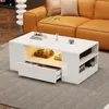 A modern white coffee table with storage is placed in a living room setting, next to an orange sofa.