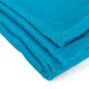 A close-up view of folded teal fabric, likely a yoga blanket. Produktbild-Vorschau