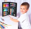 A young boy is sitting at a table with an open art set in front of him, about to draw. Podgląd zdjęcia produktu