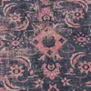 A close-up view of a patterned rug with a distressed, vintage aesthetic. Náhled obrázku produktu