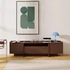 A modern living room with a TV cabinet, artwork, and a chair. Produktbild-Vorschau