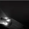 Close-up of the front of a cordless screwdriver with its LED light on, illuminating the surrounding area. Voir les images du produit
