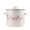 A cream-colored enamel pot with a lid, decorated with pink magnolia flowers and a butterfly. Produktbild-Vorschau