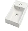 A white ceramic sink with two holes on a white background. Voir les images du produit