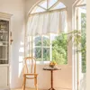 A sunlit room with a window, a chair, and a small table. Produktbild-Vorschau