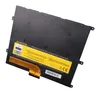 A black laptop battery with a yellow label and an orange ribbon cable. Náhled obrázku produktu
