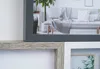 A close-up view of multiple picture frames, some containing images of home decor. Náhled obrázku produktu