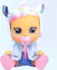 A doll with rainbow hair and a unicorn-themed outfit sits against a light gray background. Voir les images du produit
