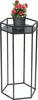 A black metal hexagonal plant stand with a pot of red flowers on top. Produktbild-Vorschau